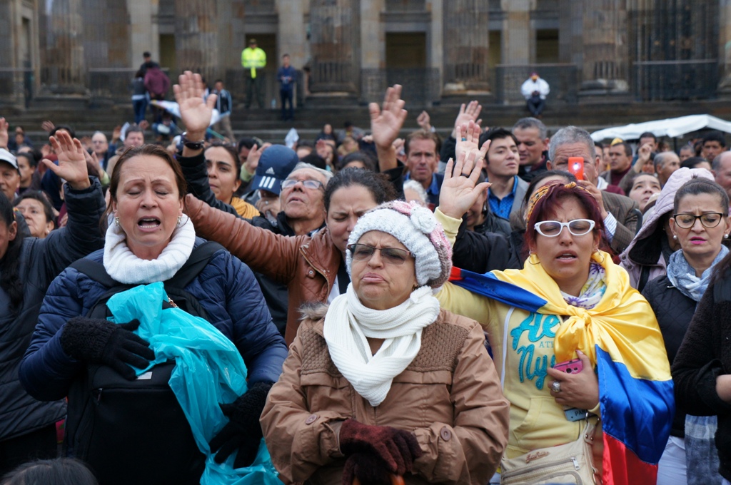Members of a Colombian mega church pray for their country ahead a final referendum on a peace to finish the guerrilla war between the The Revolutionary Armed Forces of Colombia—People's Army (FARC) and the state, the longest-running armed conflict which h