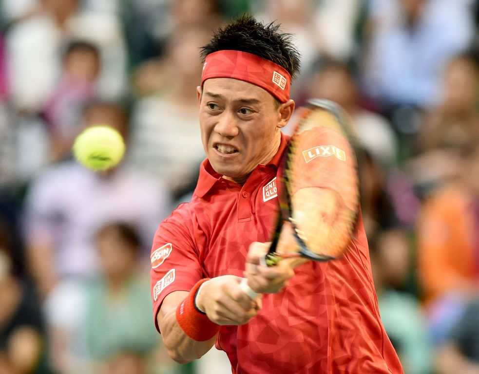 Kei Nishikori of Japan returns a shot against Joao Sousa of Portugal during the men's singles second round match at the ATP Japan Open tennis tournament in Tokyo on October 5, 2016. / AFP / TORU YAMANAKA