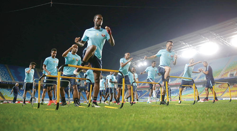 Qatari players taking part in a training session in Suwon yesterday.