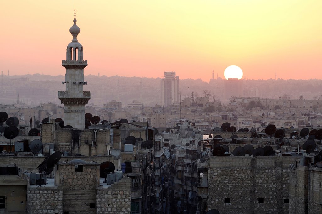 The sun sets over Aleppo as seen from rebel-held part of the city, Syria October 5, 2016. Reuters/Abdalrhman Ismail 