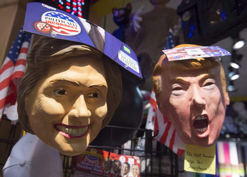 Halloween masks depicting Democratic Presidential candidate Hillary Clinton and Republican Presidential candidate Donald Trump are seen for sale at Total Party, a party store, in Arlington, Virginia. AFP / SAUL LOEB