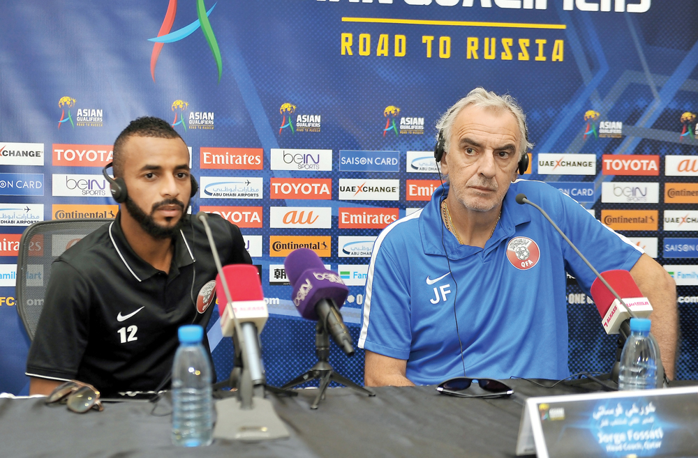 Qatar coach Jorge Fossati (right) and forward Magid Mohammed listen to a question asked by a journalist during a press briefing held yesterday, ahead of their 2018 FIFA World Cup qualifier against Syria which will be played at Al Sadd Stadium in Doha toda