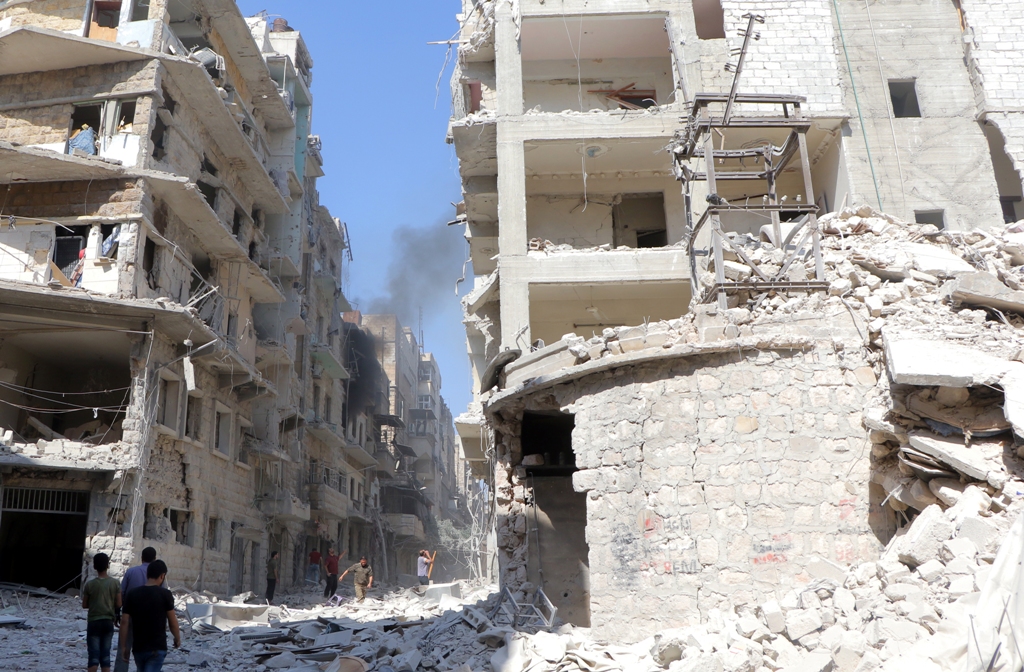 ALEPPO, SYRIA - OCTOBER 11: Syrians inspect the damage at the site of an airstrike staged by Russian army in the opposition-controlled Bustan al-Qasr neighborhood of Aleppo, Syrian on October 11, 2016. ( ?brahim Ebu Leys - Anadolu Agency )
