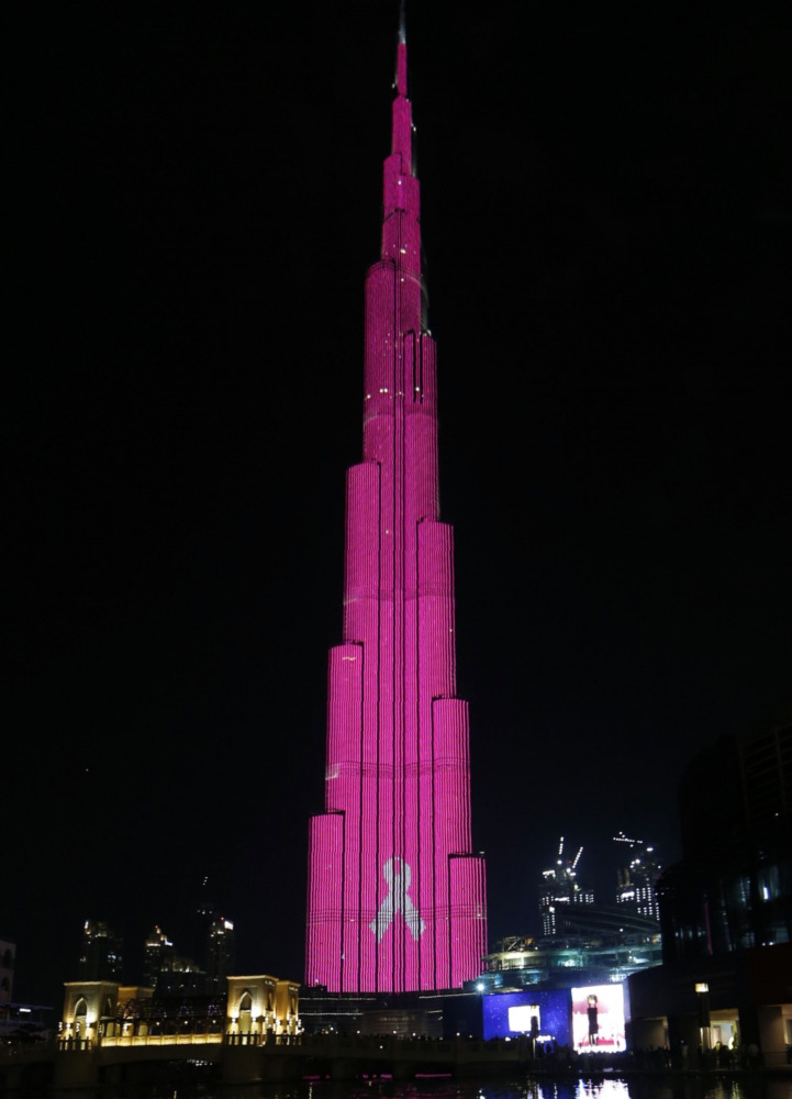 Dubai's Burj Khalifa, the world's tallest tower, is lit up in pink to raise awareness and funds to fight breast cancer, in the Gulf Emirate of Dubai on October 13, 2016. (AFP / KARIM SAHIB) 