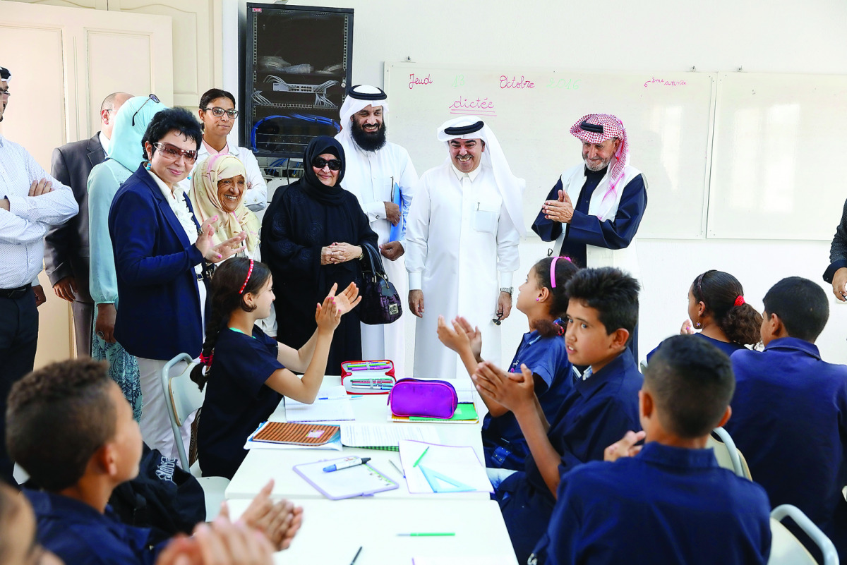 A delegation from Qatar comprising RAF officials, Qatari Ambassador and members of donor family with students at a classroom of the school in Tunisia.