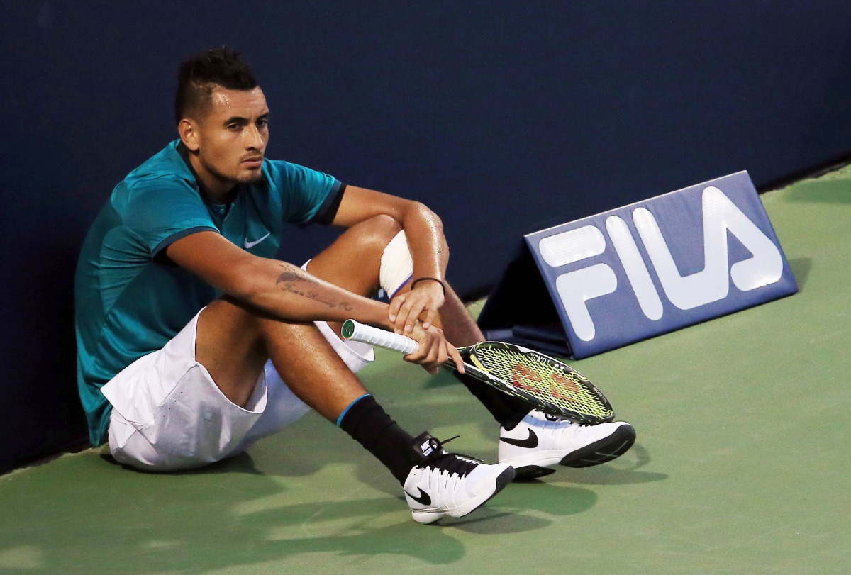  This file photo taken on July 25, 2016 in Toronto, shows Nick Kyrgios of Australia sitting at the end of the court as he waits for the final game in his match against Denis Shapovalov of Canada during Day 1 of the Rogers Cup at the Aviva Centre. (AFP / G