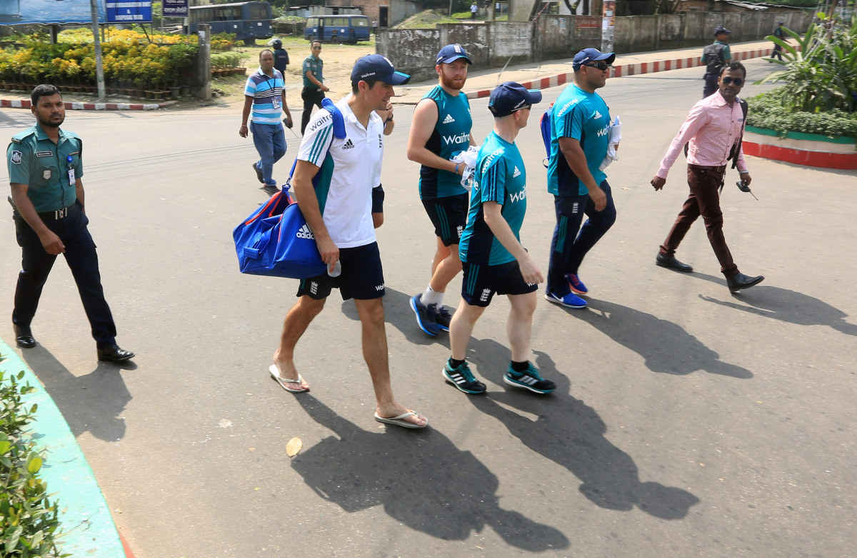 England cricket captain Alastair Cook (centre L) walks back to the hotel after practice in Chittagong on October 18, 2016, ahead of the first Test match against Bangladesh on October 20. (AFP)