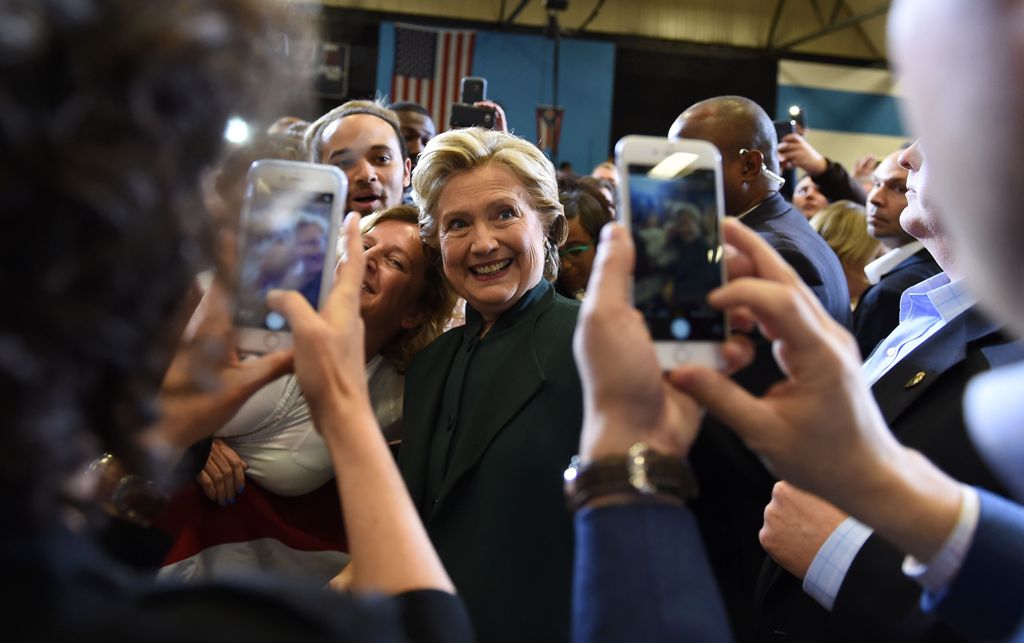 US Democratic presidential nominee Hillary Clinton greets supporters during a campaign rally at Cuyahoga Community College in Cleveland, Ohio, October 21, 2016. / AFP / Robyn Beck