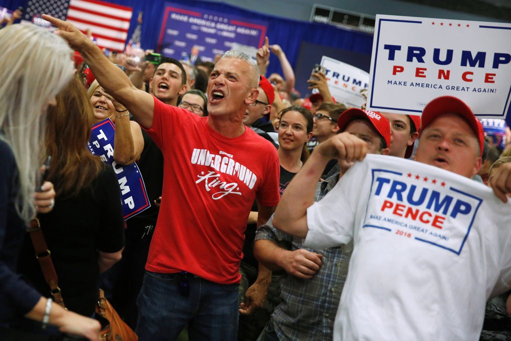Supporters of Republican US presidential nominee Donald Trump jeer reporters during Trump's remarks to a campaign rally in Newtown, Pennsylvania, U.S. October 21, 2016. Reuters/Jonathan Ernst
