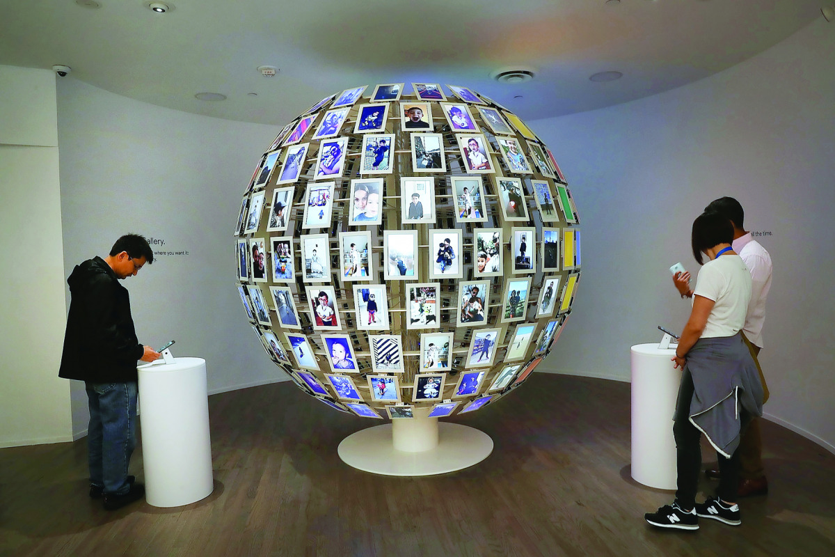 People visit the new Google pop-up shop in the SoHo neighbourhood in New York City, yesterday. The shop lets people try out new Google products such as the Pixel phone, Google Home, and Daydream VR. The products will be available for purchase offsite at V