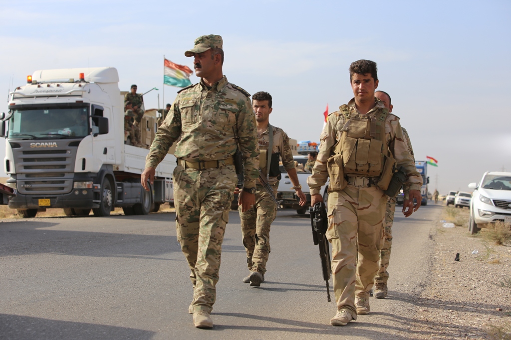 Peshmerga forces are seen on armoured vehicles as they are on their way to Kirkuk for the planned Havice Operation during an operation to retake Iraq's Mosul from Daesh terrorists, in Nineveh, Iraq on October 21, 2016.  Feriq Fereç - Anadolu Agency 