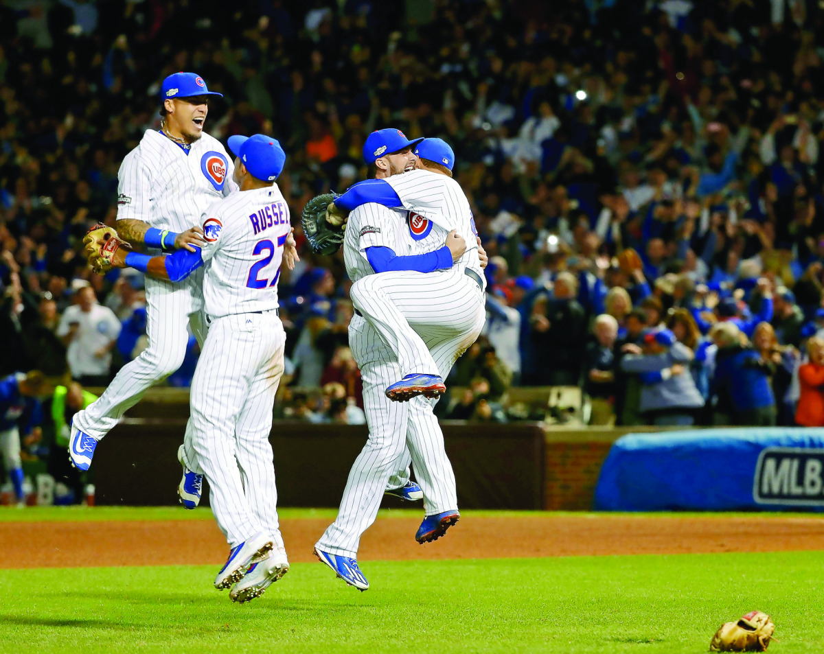 The Chicago Cubs celebrate after winning game six of the 2016 NLCS playoff baseball series at Wrigley Field in Chicago, IL, USA, on Saturday.