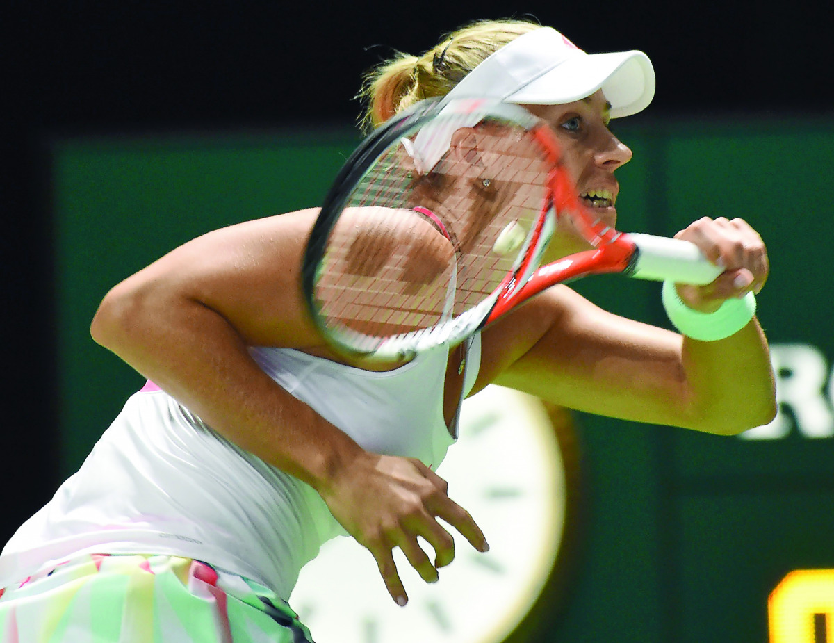 German’s Angelique Kerber plays against Romania’s Simona Halep in their women’s singles match during the WTA finals tennis tournament in Singapore, yesterday.