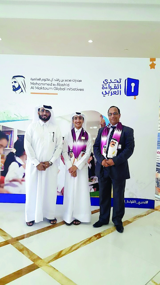 Qatari student Abdullah Khalid Al Kaabi (centre).