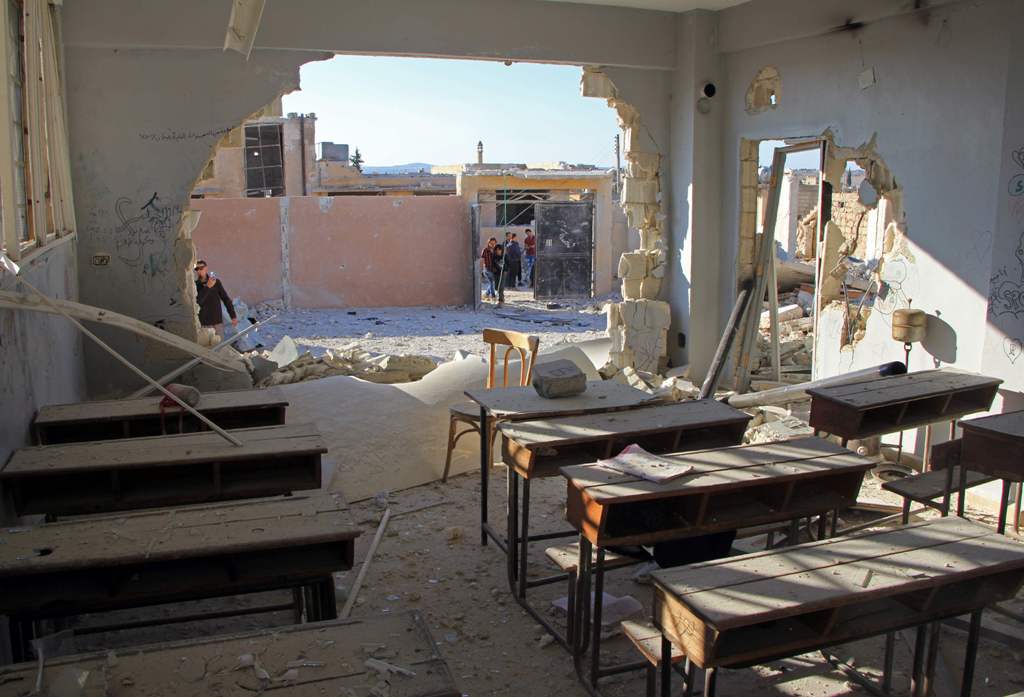 A general view shows a damaged classroom at a school after it was hit in an air strike in the village of Hass, in the south of Syria's rebel-held Idlib province on October 26, 2016. / AFP / Omar haj kadour
