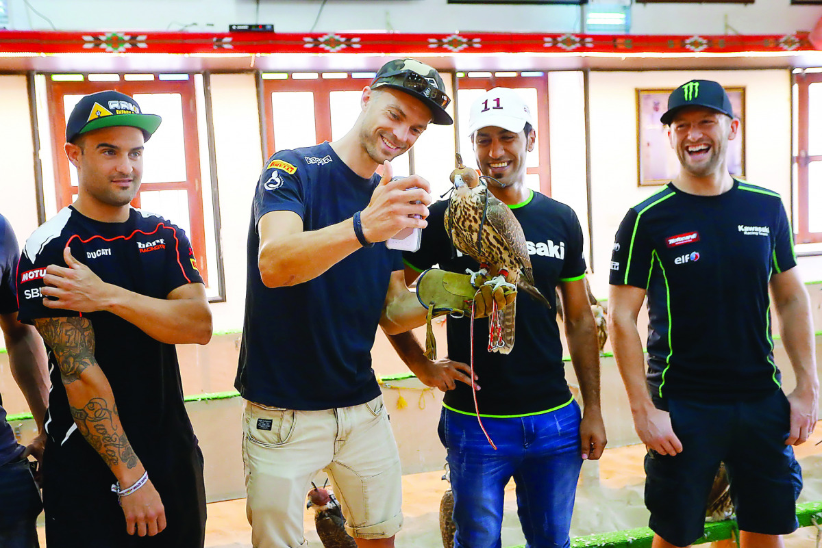 A rider holding pose for a photo with a falcon at the Falcon Centre at Souq Waqif. 