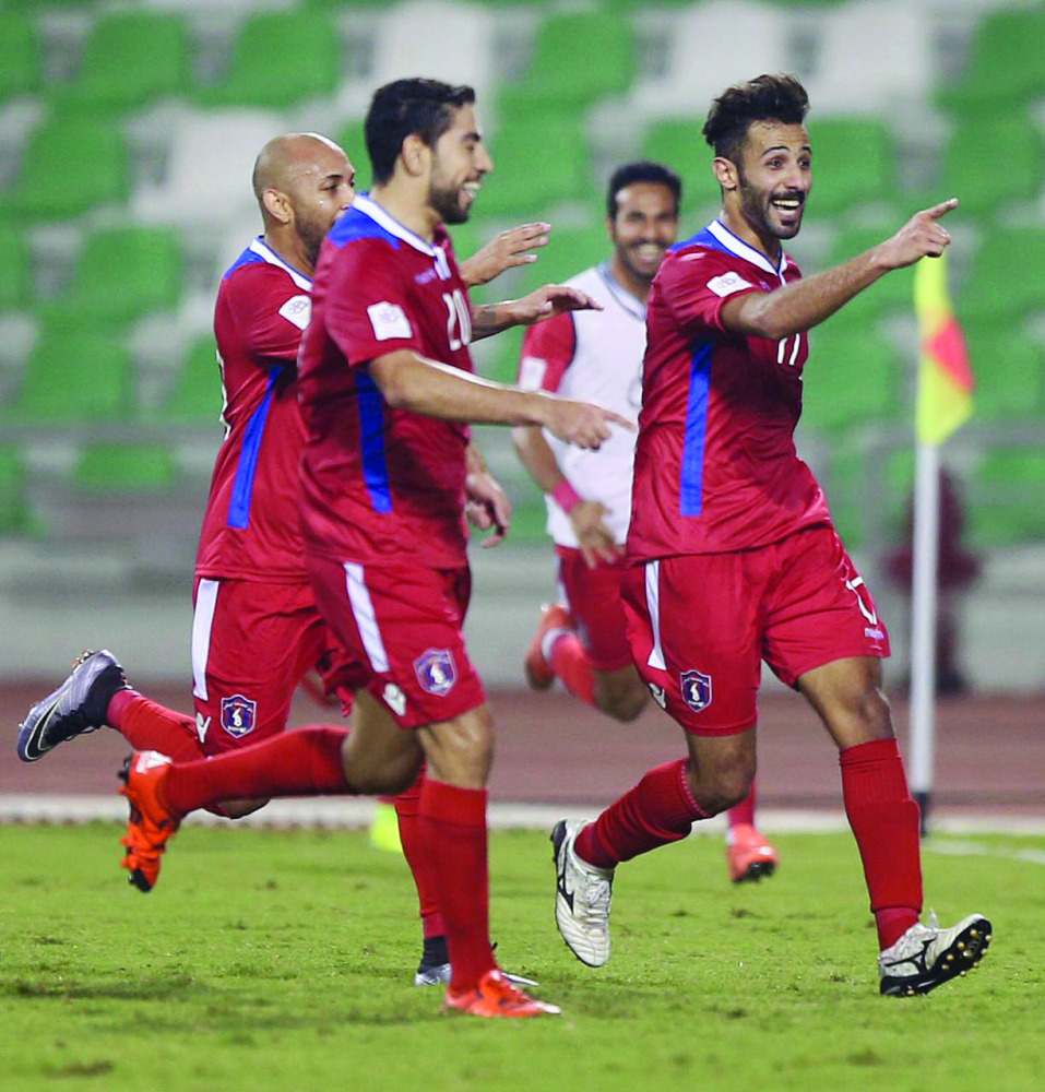 Al Shahaniya’s Abdulla Khalid (right) celebrates after scoring his team’s second goal against Al Sailiyah in their Qatar Stars League match at Hamad Bin Khalifa Stadium yesterday. Later, Al Khor beat Al Ahli 3-1 at the same venue.