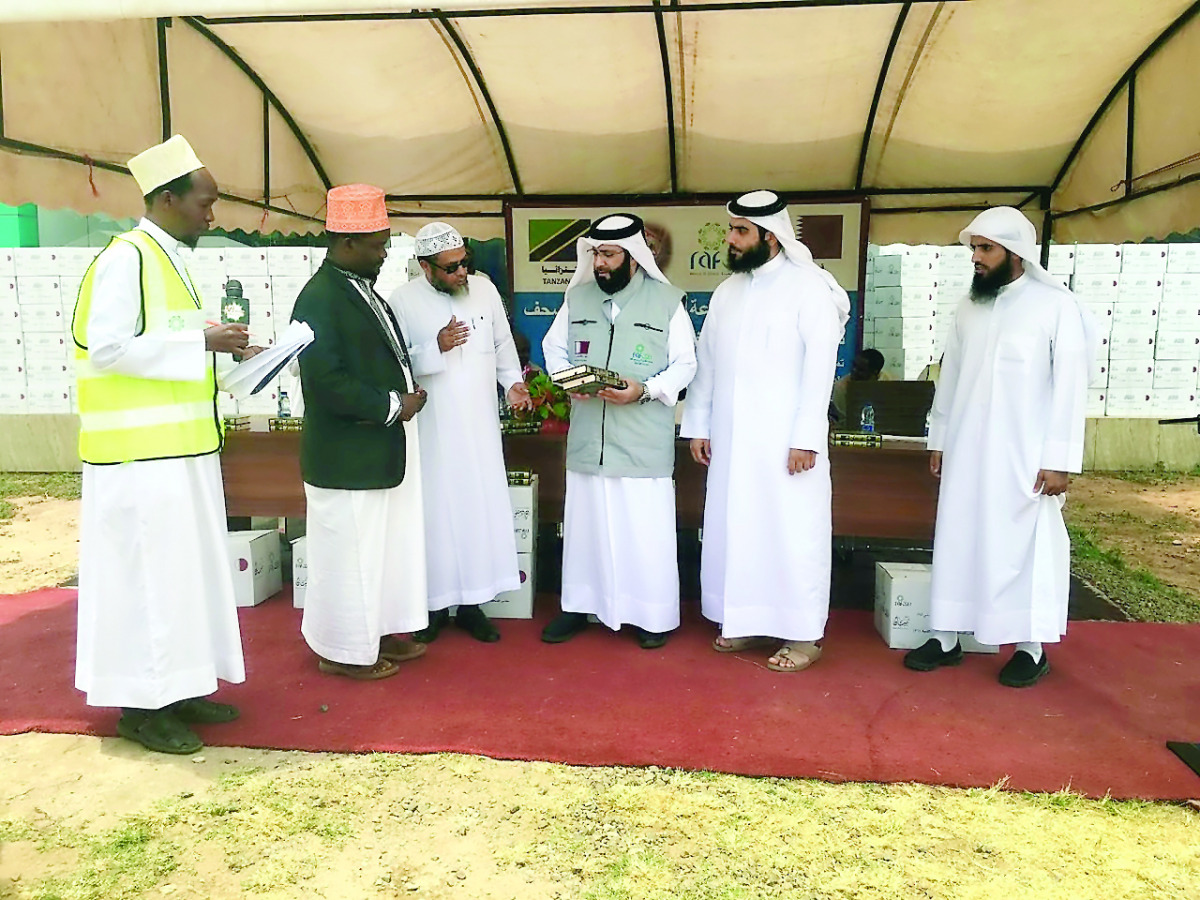RAF officials interact with representatives of local Islamic organisation at a distribution centre for copies of the Holy Quran in Tanzania.