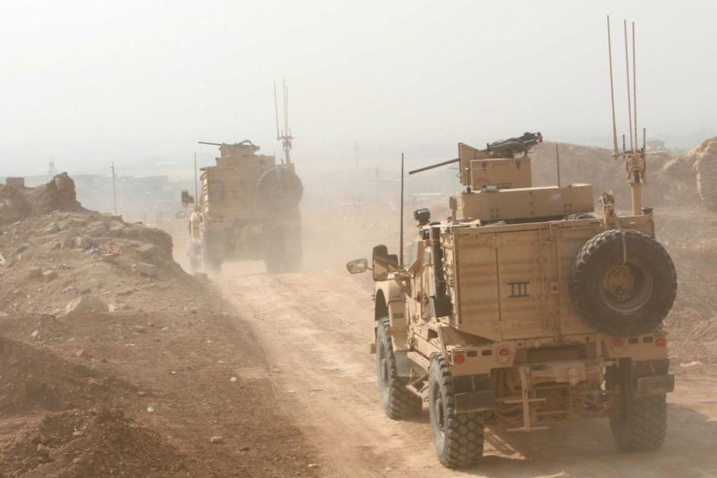 Peshmerga military vehicles drive north of Mosul during the operation to retake the city. / Reuters: Ari Jalal.