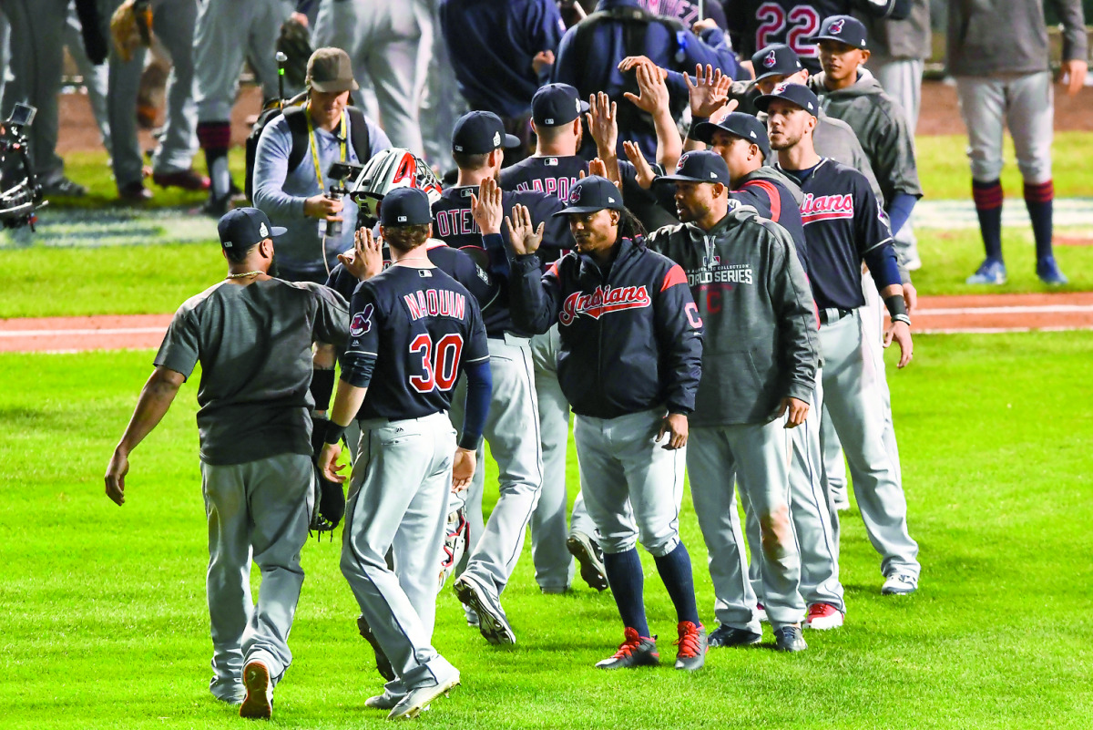 Cleveland Indians players celebrate after game four of the 2016 World Series against the Chicago Cubs at Wrigley Field on Saturday. The Indians defeated the Cubs 7-2.
