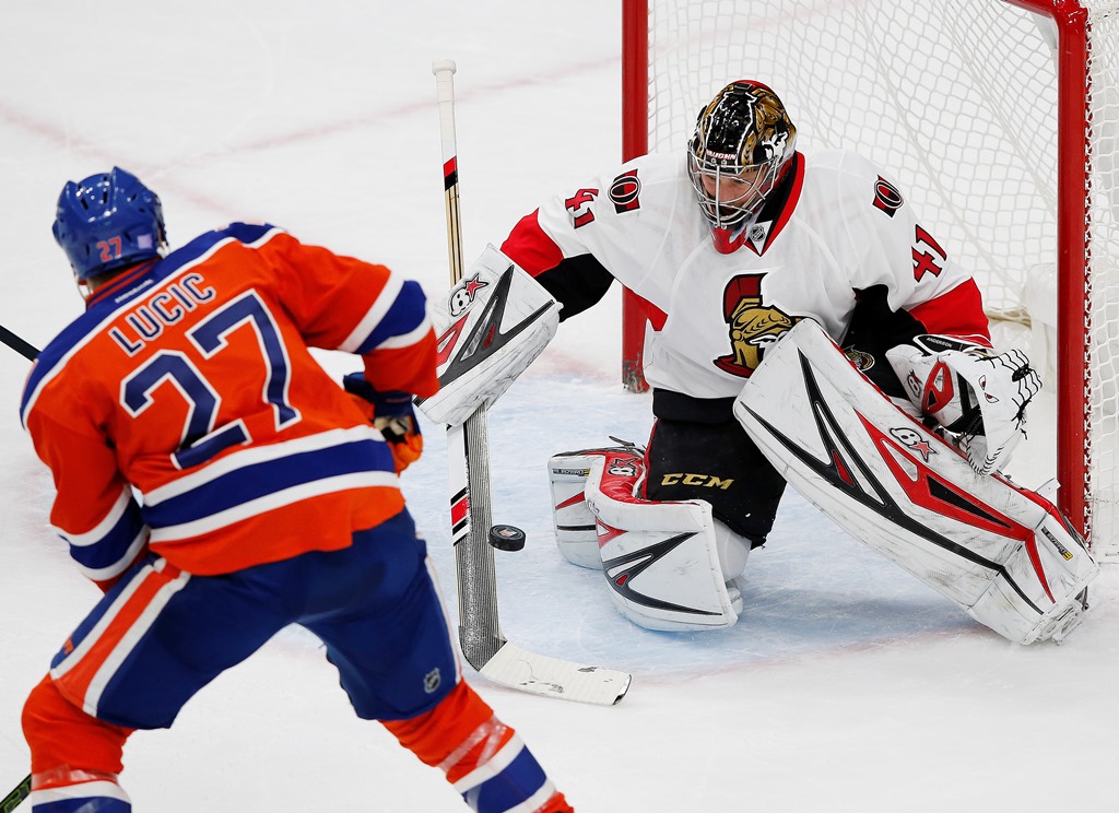 Ottawa Senators goaltender Craig Anderson (41) makes a save on Edmonton Oilers forward Milan Lucic (27) during the first period at Rogers Place. Mandatory Credit: Perry Nelson-USA TODAY Sports