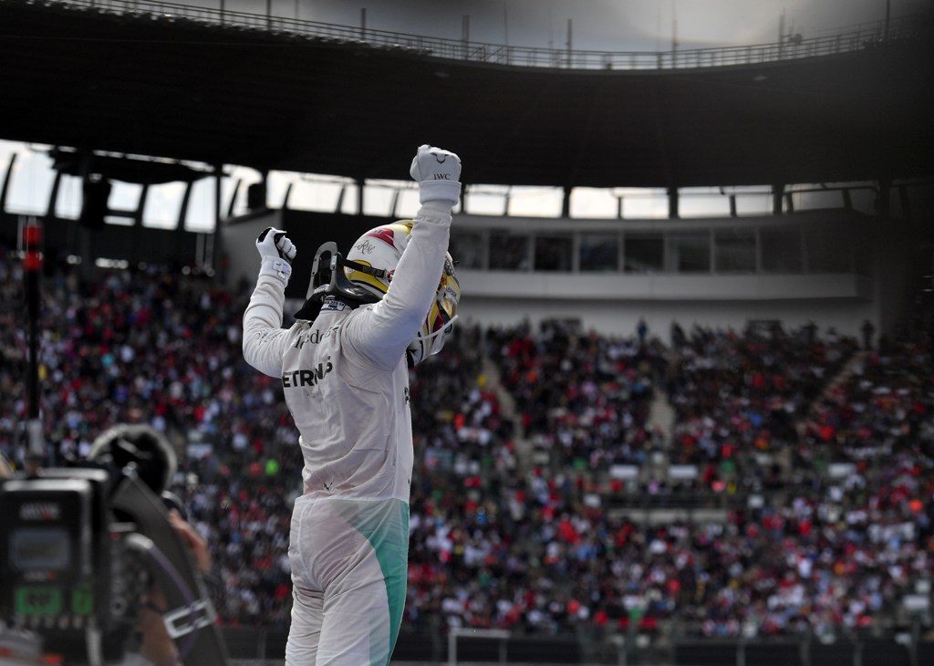 Mercedes AMG Petronas F1 Team British driver Lewis Hamilton, reacts after winning the Formula One Mexico Grand Prix at the Hermanos Rodriguez circuit, in Mexico City on October 30, 2016. / AFP / YURI CORTEZ
