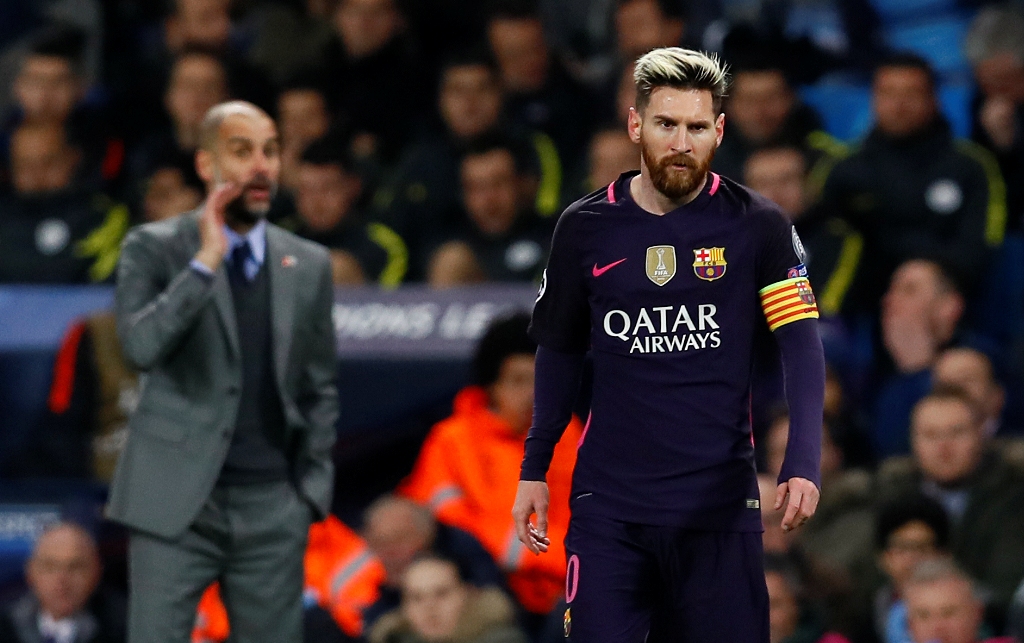 Manchester City manager Pep Guardiola and Barcelona's Lionel Messi. Reuters / Jason Cairnduff
