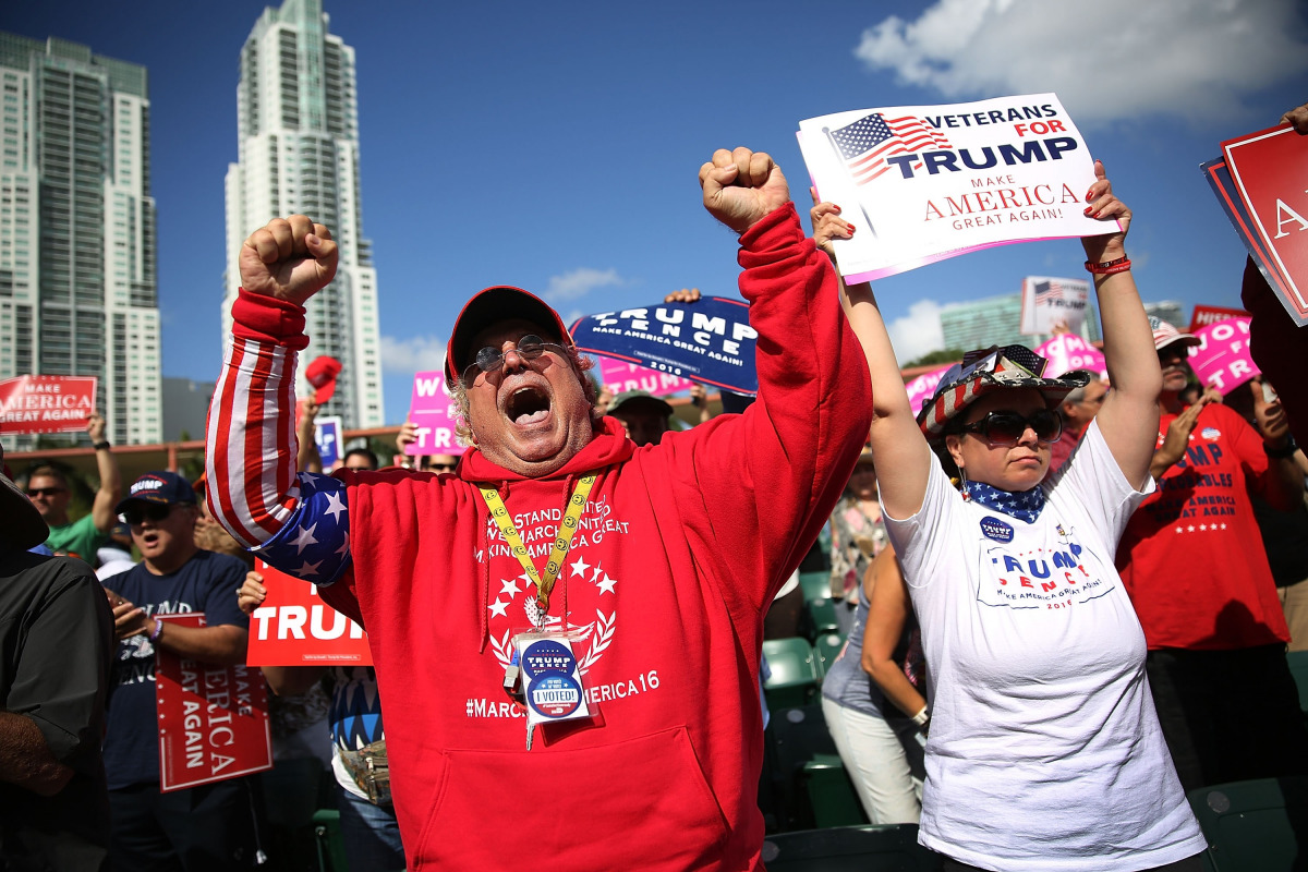 Fermin Vazquez cheers before the arrival of Republican presidential candidate Donald Trump during his campaign rally at the Bayfront Park Amphitheater on November 2, 2016 in Miami, Florida. Trump continues to campaign against his Democratic challenger Hil