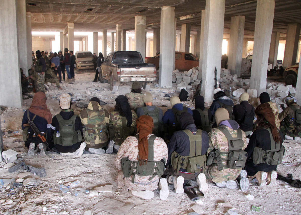  Rebel fighters from the Jaish al-Fatah (or Army of Conquest) brigades pray inside a building on November 3, 2016, at an entrance to Aleppo, in the southwestern frontline near the neighbourhood of Dahiyet al-Assad, during a rebel offensive to break a thre