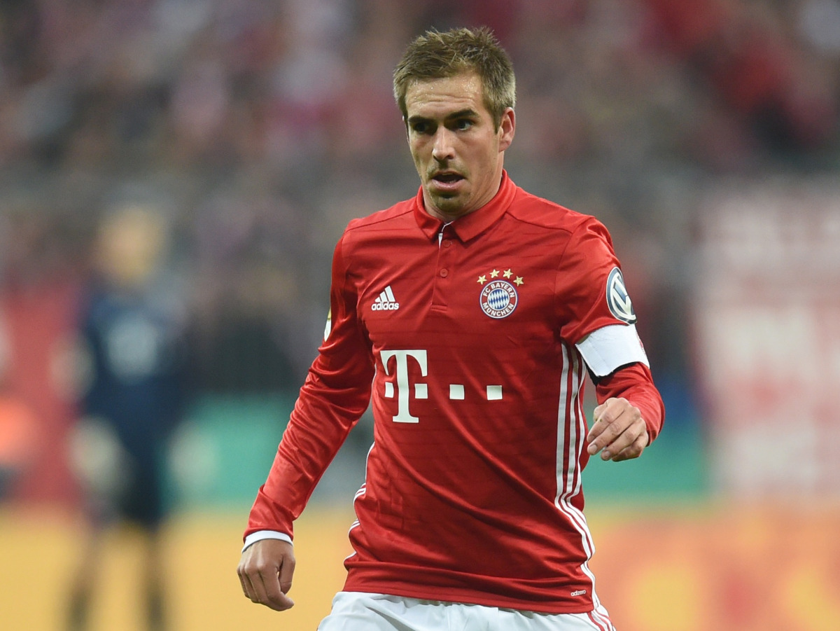 (FILES) This file photo taken on October 26, 2016 shows Bayern Munich's defender Philipp Lahm playing the ball during the German Cup DFB Pokal second round football match FC Bayern Munich v FC Augsburg in Munich, southern Germany. AFP / CHRISTOF STACHE