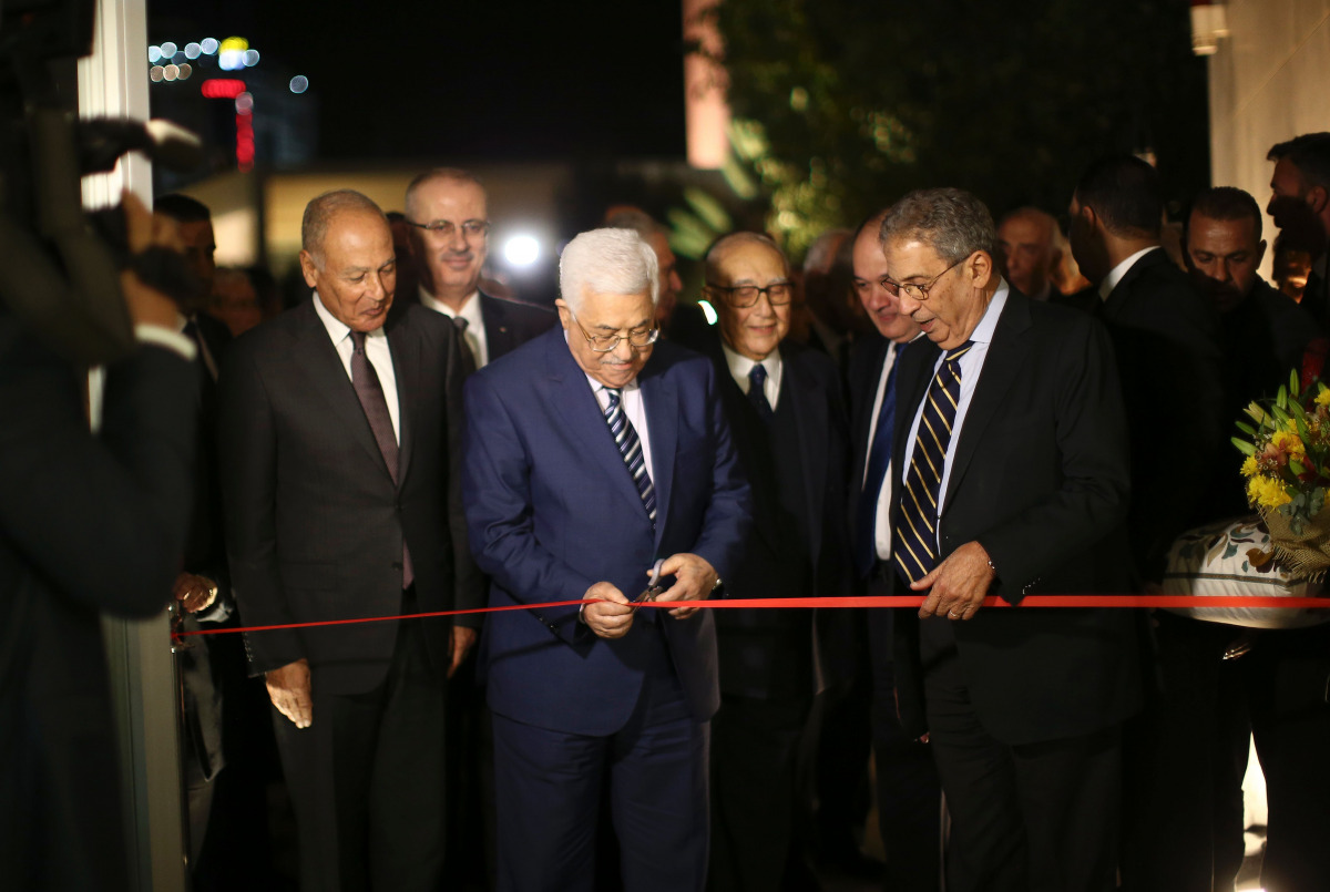 Ahmed Aboul Gheit, Secretary-General of the Arab League (L), Palestinian president Mahmud Abbas (C) and former Secretary-General of the Arab League Amr Mousa cut the ribbon during the inauguration ceremony of late Palestinian leader Yasser Arafat's Museum