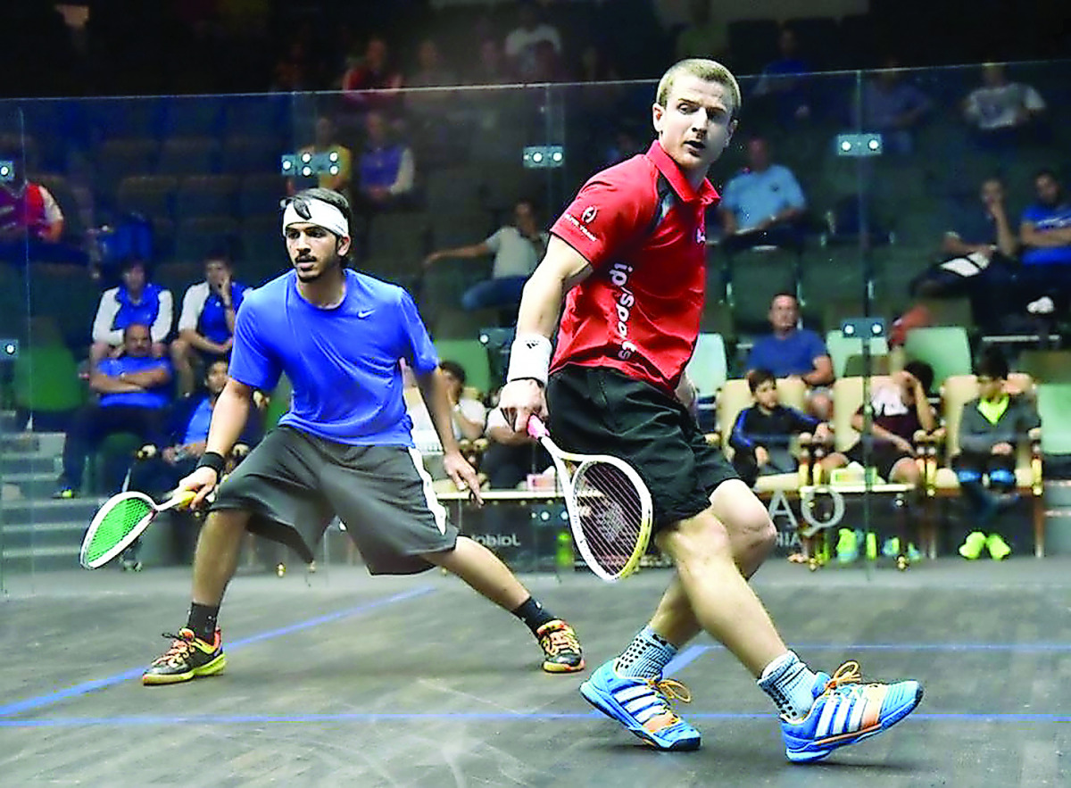 Qatari player Umair Zaman (left) and Alan Clyne of Scotland in action.  