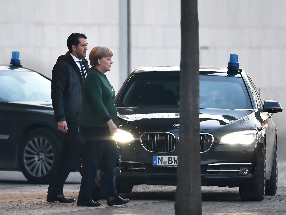 German Chancellor Angela Merkel leaves the chancellery after a meeting with party leaders of Germany's ruling coalition Sigmar Gabriel and Horst Seehofer, in an new attempt to reach consensus on a nominee to replace outgoing president Joachim Gauck, on No