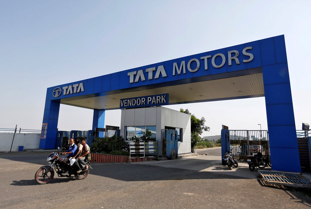 Men ride a motorbike as they come out of a past a Tata Motors car plant at Sanand in the western Indian state of Gujarat, India, October 27, 2016. REUTERS/Amit Dave/File Photo