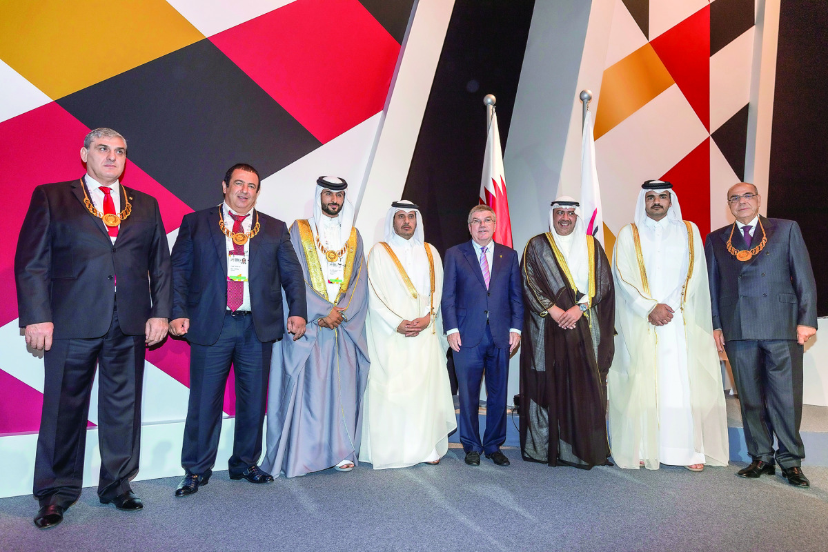 Prime Minister and Interior Minister H E Sheikh Abdullah bin Nasser bin Khalifa Al Thani and Qatar Olympic Committee (QOC) President H E Sheikh Joaan bin Hamad Al Thani with top officials after during the opening of  the 21st General Assembly Meeting of t