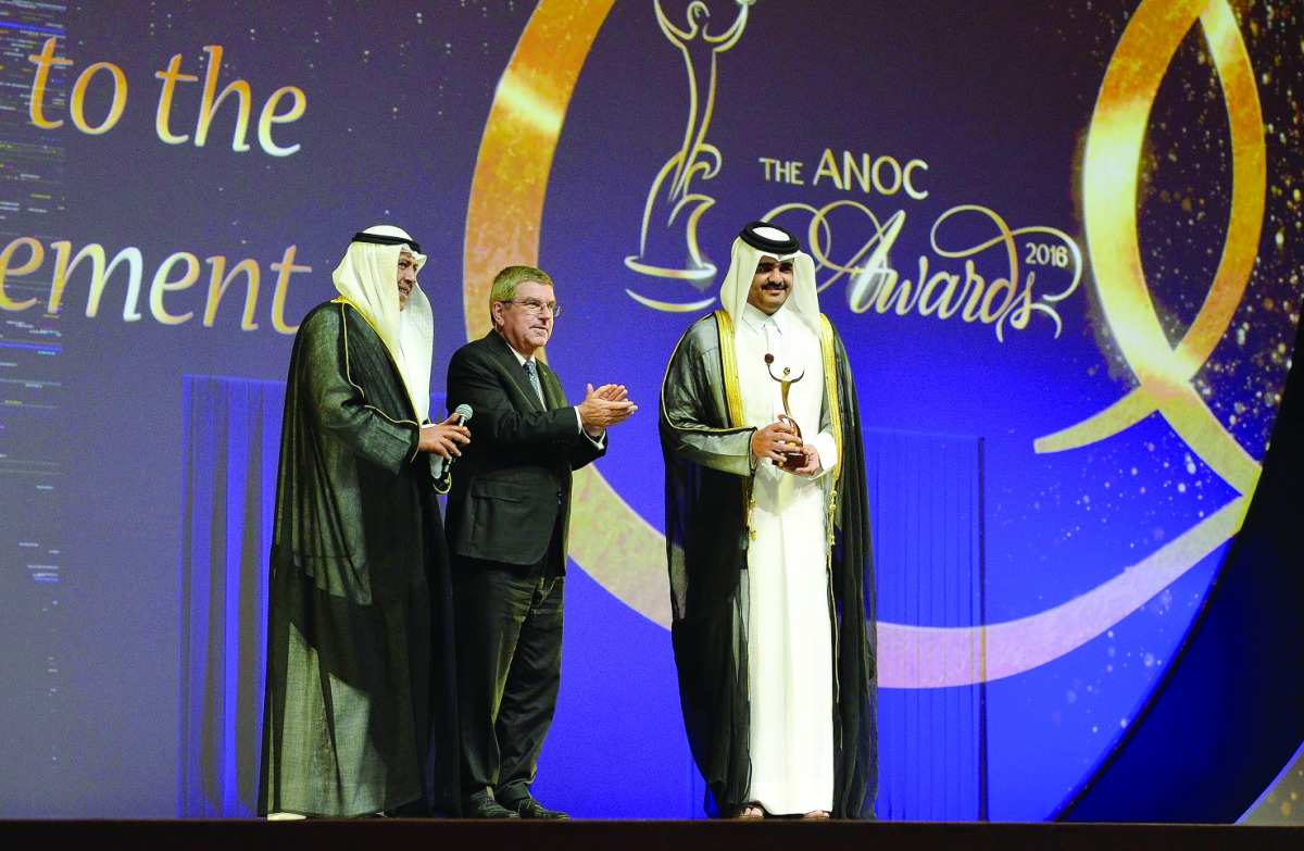 Sheikh Joaan bin Hamad Al Thani, President of the QOC,  poses for a photograph with Sheikh Ahmad Al Fahad Al Sabah, President of ANOC (left) and Thomas Bach, the IOC President, during the ANOC General Assembly in Doha.
