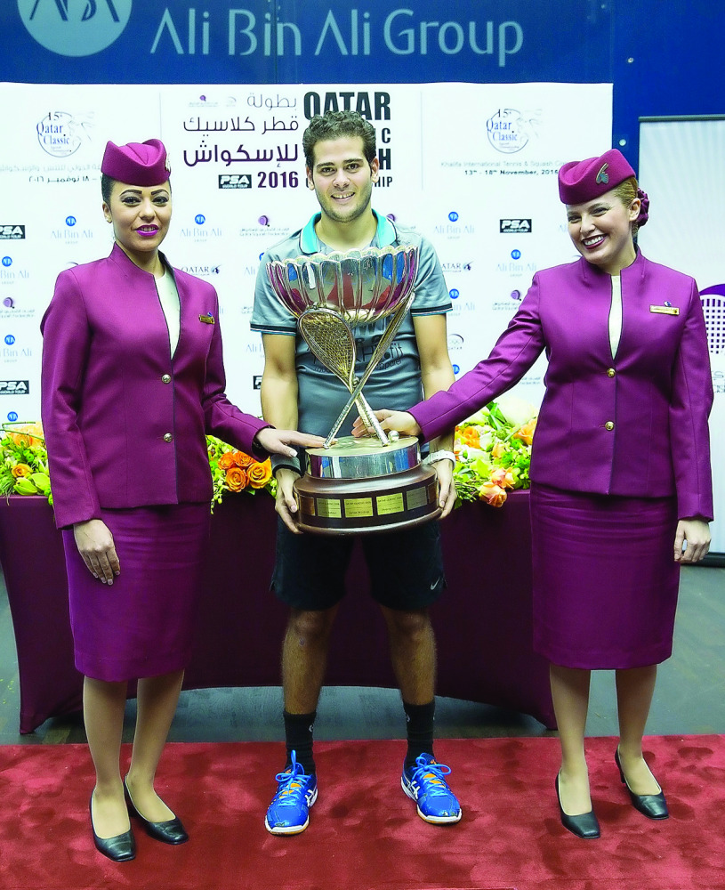 World Champion Karim Abdel Gawad of Egypt poses with the Qatar Classic 2016 trophy after defeating World No.1 Mohamed El Shorbagy of Egypt in the final at the Khalifa International Squash Complex on Friday.