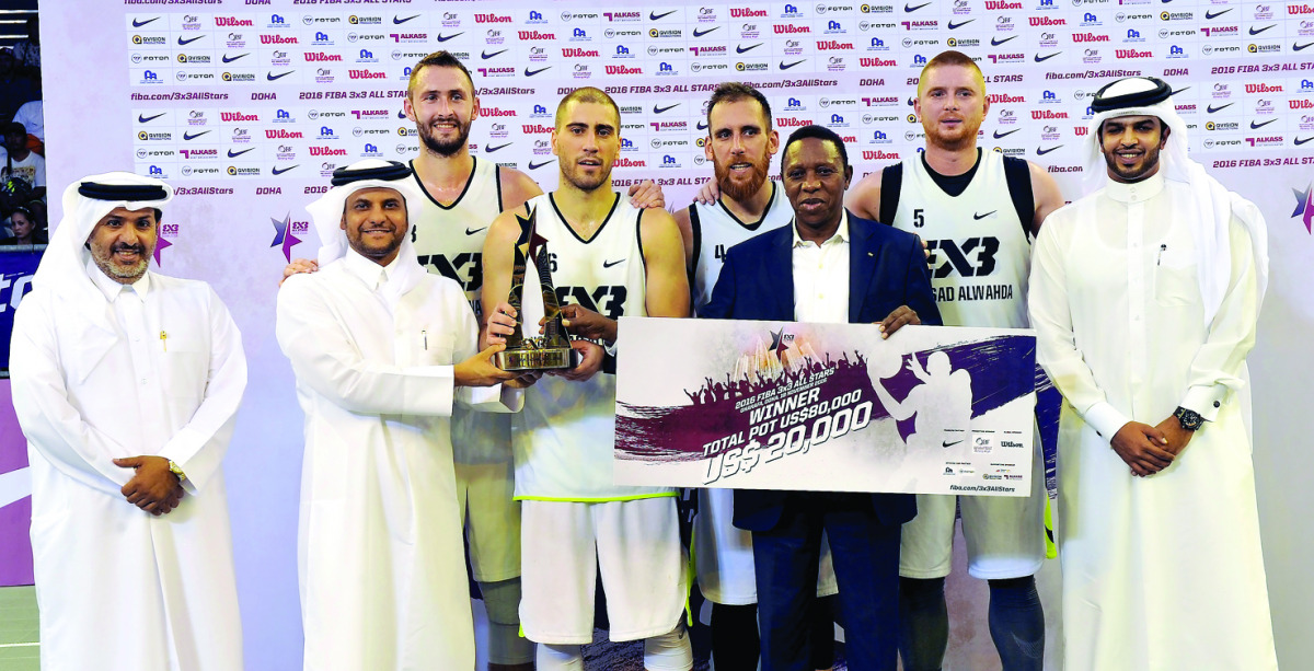 Qatar Basketball Federation (QBF) President Sheikh Saoud bin Abdulrahman Al Thani, (second left) presenting the winner's trophy to team Novi Sad Al Wahda of UAE during the FIBA 3x3 All Stars Basketball Tournament 2016 at Doha yesterday. Pics by: Kammutty 