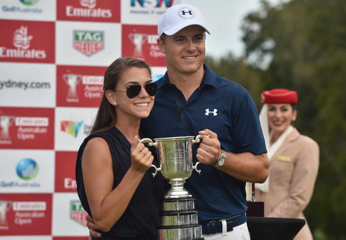 US golfer Jordan Spieth poses with the Stonehaven Cup amd his girlfriend Annie after winning the Australian Open golf tournament at the Royal Sydney Golf Club in Sydney on November 20, 2016. (AFP / PETER PARKS)
