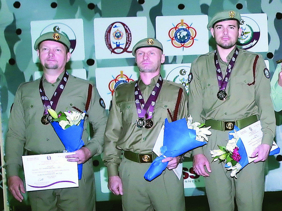 Silver medallists of Men's 25m Rapid Fire Pistol event,  Qatari shooters  Oleg Engachev, Ivan Bidniak and Konstantin Maltsev.