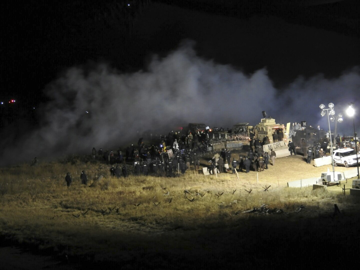 Law enforcement officers surround demonstrators protesting against plans to pass the Dakota Access pipeline during a standoff at the Backwater Bridge in Morton County, North Dakota, U.S., November 20, 2016. Courtesy of Morton County Sheriff's Department/H