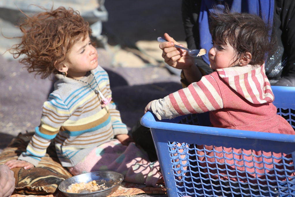 Children are seen as the internally relocated people, who fled their homes due to the clashes, wait to be placed to refugee camps, at Omerkapci village of Bashiqa town in Mosul, Iraq on November 20, 2016 as the operation to liberate Iraq’s Mosul from IS c