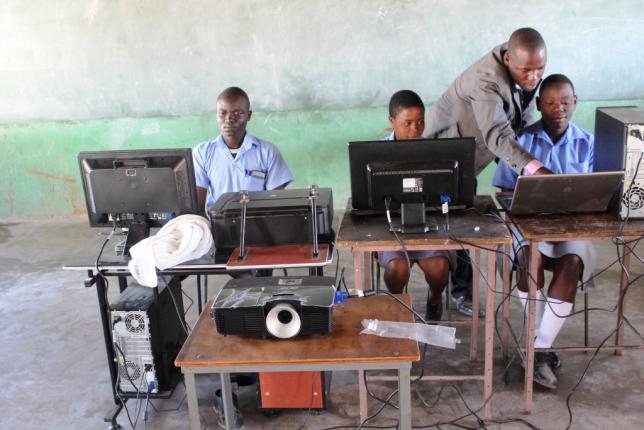 Pupils use solar-powered computers at Gomba High School in Gutu, Zimbabwe. (TRF / Jonathan Njerere) 