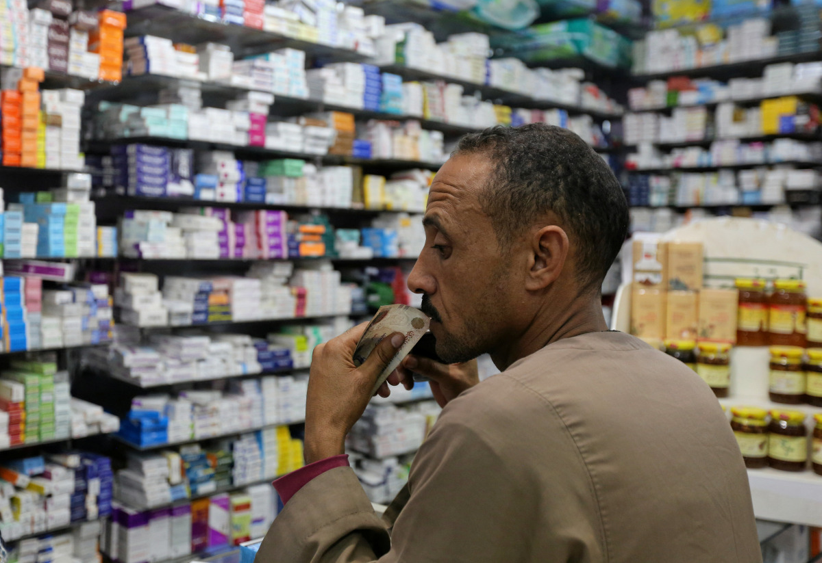 A customer waits for his medicine in a pharmacy in downtown Cairo, Egypt, November 17, 2016. Picture taken November 17, 2016. REUTERS/Mohamed Abd El Ghany