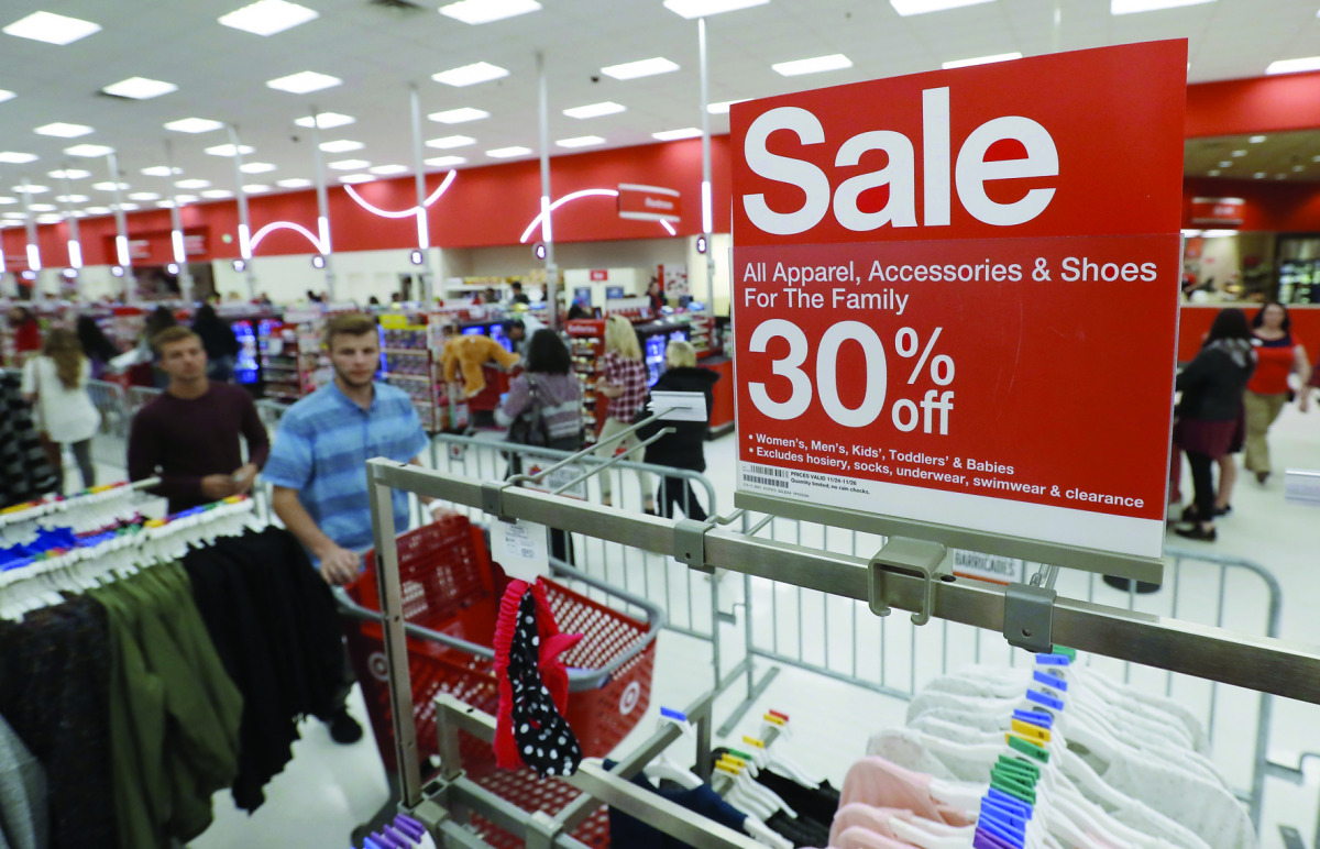 Shoppers check out deals at a Target in Orem, Utah. Retailers kicked off the unofficial start of the holiday season with sales in many instances began on the Thanksgiving holiday. 