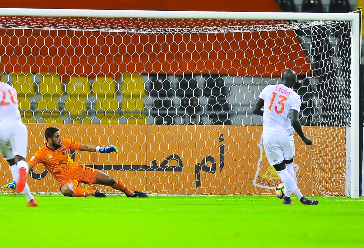 Umm Salal Yannick Sagbo scoring a penalty goal for Umm Slal against Lekhwiya during Qatar Stars League match at Qatar SC yesterday. Picture by: Baher Amin / The Peninsula