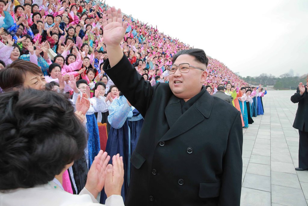 North Korean leader Kim Jong Un takes part in a photo session with the participants of the 6th Congress of the Democratic Women's Union of Korea in this undated photo released by North Korea's Korean Central News Agency (KCNA) in Pyongyang on November 22,