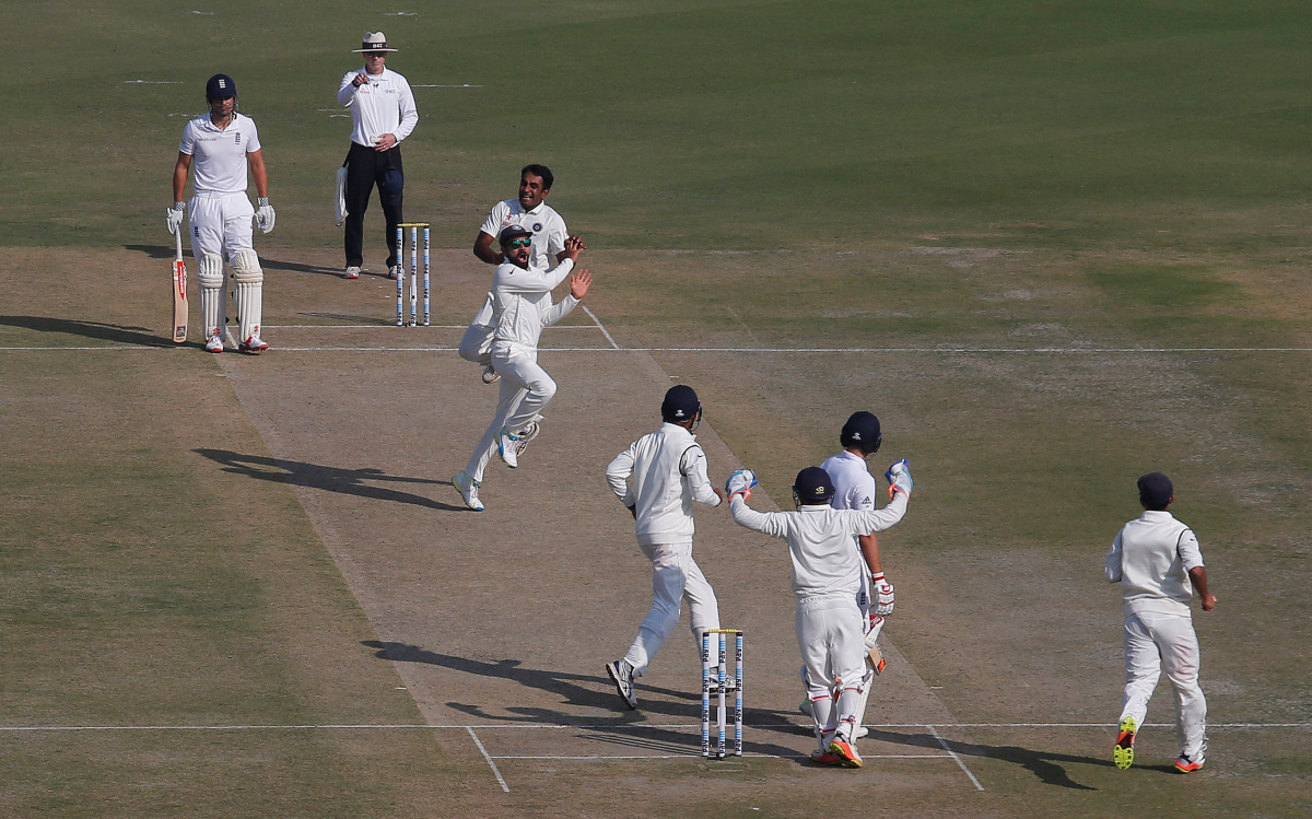 Indian players celebrate the dismissal of England's Joe Root. (Reuters/Adnan Abidi)