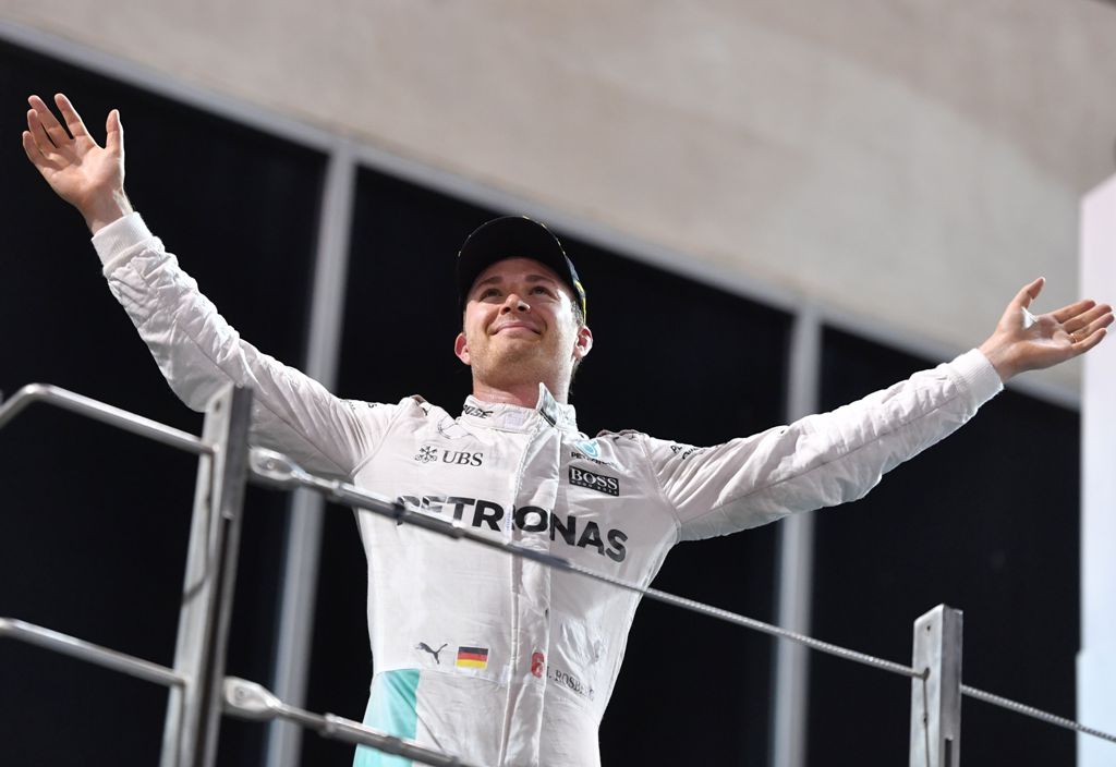 Mercedes AMG Petronas F1 Team's German driver Nico Rosberg celebrates at the end of the Abu Dhabi Formula One Grand Prix at the Yas Marina circuit on November 27, 2016.  AFP / Andrej ISAKOVIC
