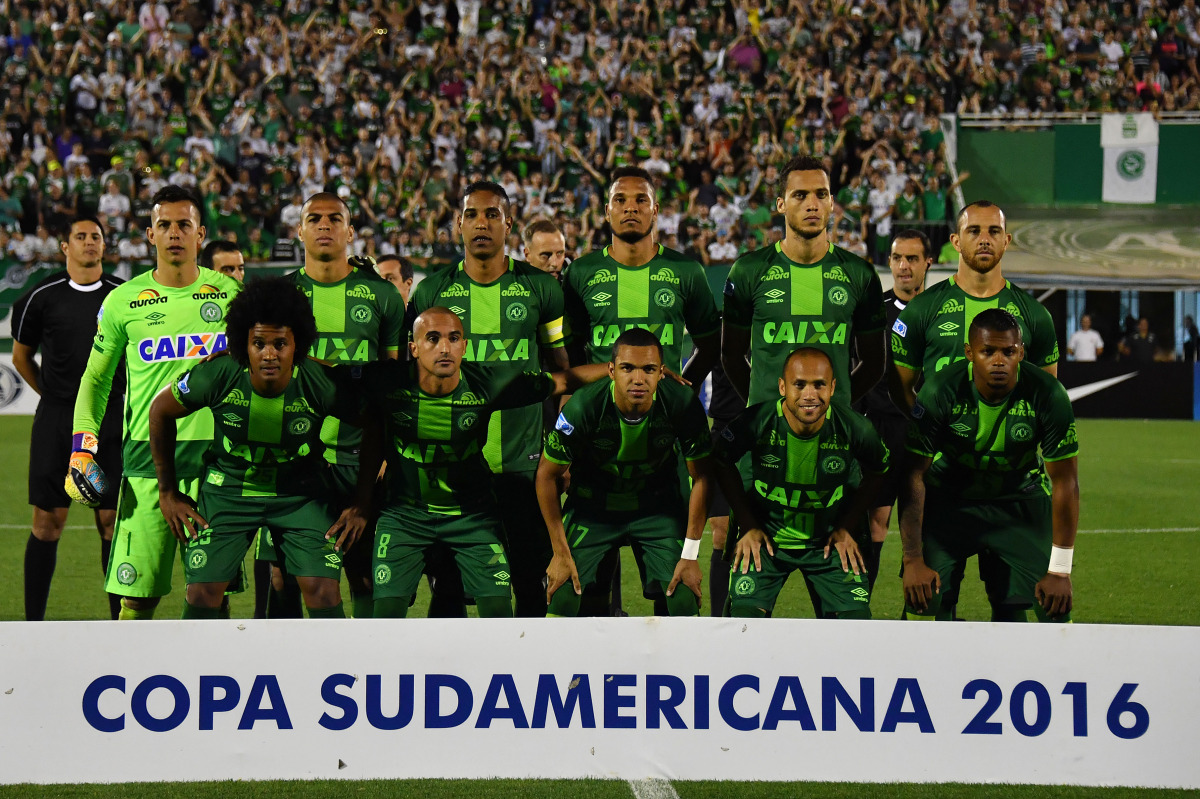 This file photo taken on November 24, 2016 shows Brazil's Chapecoense players posing for pictures during their 2016 Copa Sudamericana semifinal second leg football match against Argentina's San Lorenzo held at Arena Conda stadium, in Chapeco, Brazil. A pl